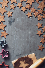 Christmas gingerbread cookies on a blue background with star shapes.