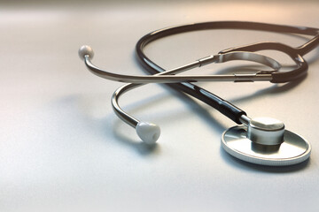 stethoscope is isolated on the white table background of the doctor in the hospital