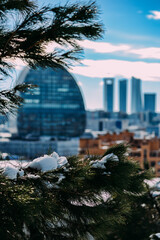 Fototapeta na wymiar Bokeh view of the skyline of Madrid, Spain - winter scene