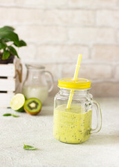 fresh fruit and berry smoothies on a light, morning table. healthy eating, proper nutrition, farming, healthy lifestyle, breakfast, detox, organic food, soncept. space for text