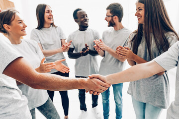 close up. the handshake of the delegates of the youth summit students