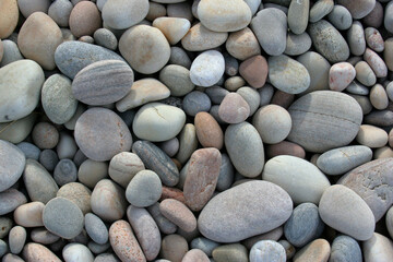 Fototapeta na wymiar Smooth pebbles on beach in Scotland