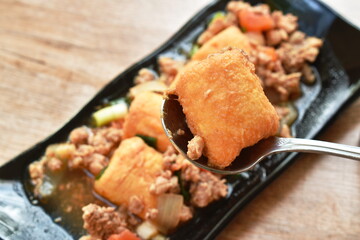 deep fried egg tofu with chop pork in sweet sauce on plate