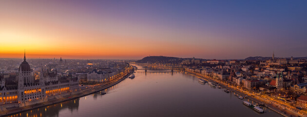 Panoramic aerial drone shot of danube wich chain bridge Fisherman Bastion sunrise in Budapest dawn