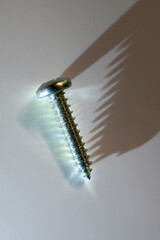 light and shadows on a steel screw 
