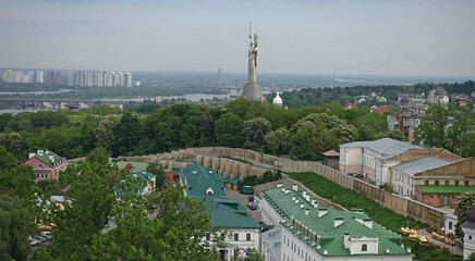 Fototapeta premium View of the architecture of Kiev and the Motherland monument on a summer day
