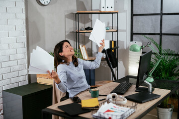 Happy businesswoman in office. Businesswoman celebrating a big accomplishment at work