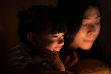 daughter and mother in winter at home, warm cozy family lifestyle concept
