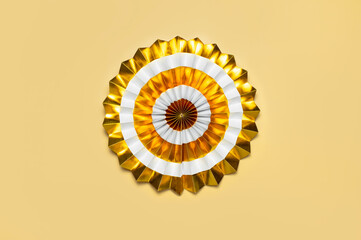 Festive white and gold paper fans for party, birthday, holiday, wedding on beige background top view copy space. Origami. Decorative objects. Colorful abstract background. Festive trendy backdrop