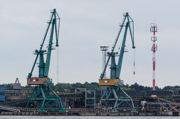 Fototapeta na wymiar SEAPORT - Port cranes at the transshipment terminal 