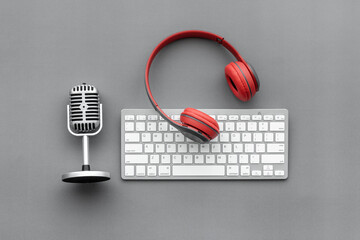 Audio equipment background. Retro microphone and headphones on studio table