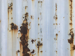 Old paint on a shipping container. Paint texture. Rust.