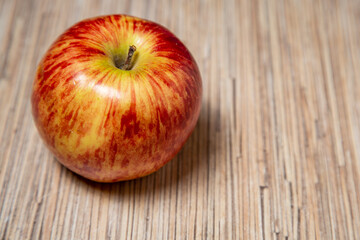 red apple on wooden table