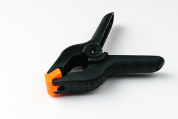 Obraz premium Plastic tongs on a white background