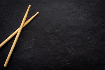 Top view of drum sticks with space for text. Music background