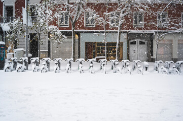 bicycles in the street of madrid covered with snow. Borrasca Filomena.Madrid.Spain