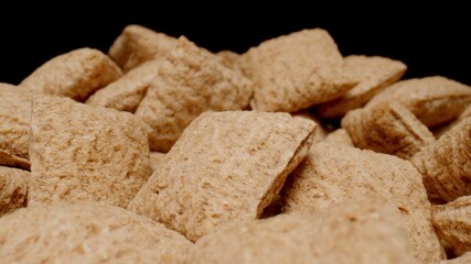 MACRO: Fitness flakes on a black background