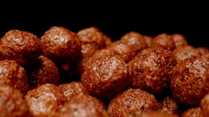 MACRO: Sweet chocolate balls on a black background