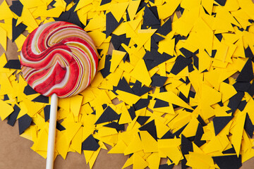 lollipop on yellow black background