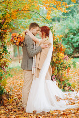 Bride and groom outdoors. Wedding ceremony. Wedding arch