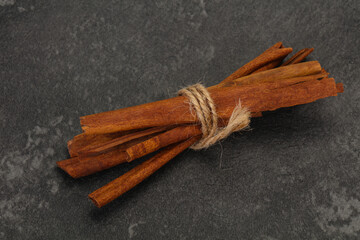 Aroma cinnamon sticks over dark