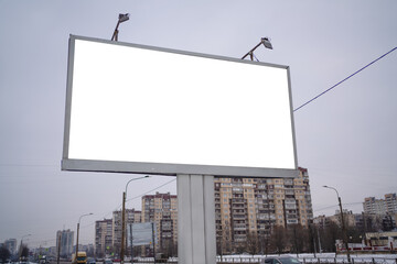 billboard in the city with a white field for advertising