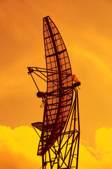 Telecommuting receiver on a bright sky background. Military locator, radar - 405485247