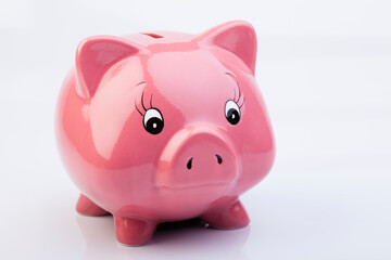 Pink Piggy Bank. Romanian currency, stack of coins