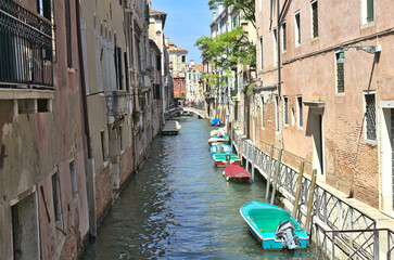 Boats in a canal in Venice, Italy