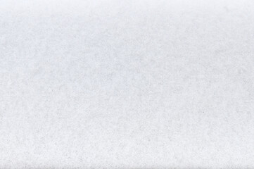 Fototapeta premium Texture of white snow close up