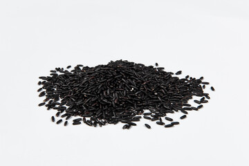 Heap of raw Black rice on white background.