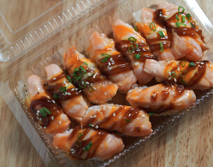 Salmon sushi in the plastic box