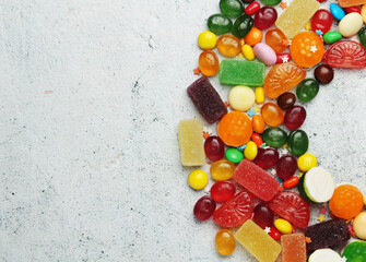 Bright candy lollies on white background