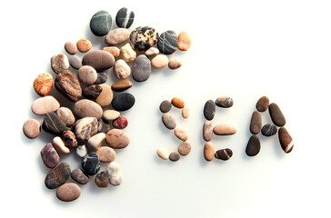The word sea of sea pebbles on a light background.
