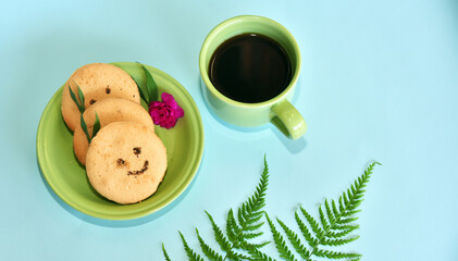 Smiling face cookies isolated with a blue light background