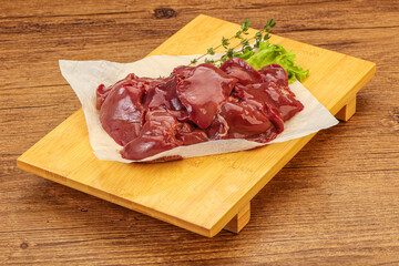Raw chicken liver over board