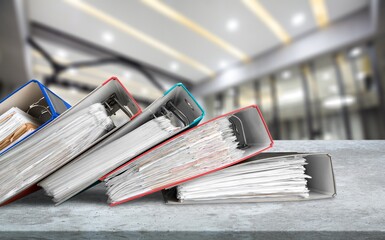 File folders with paper documents on the desk