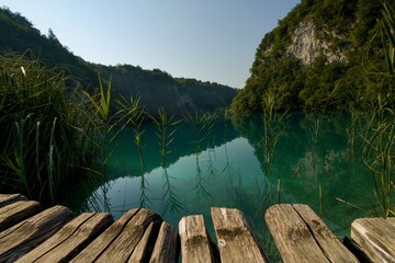 Picturesque wooden path in Plitvice Lakes National Park (Plitvička jezera). Colorful summer...