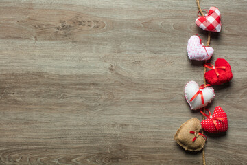 Handmaded hearts on wooden background. Valentine's day card