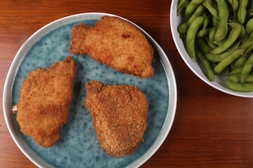 breaded meat with fried potatoes and edamame as kids food