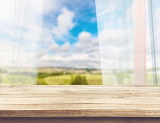 Kitchen wooden table on blur window background