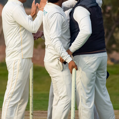 New Delhi India – July 01 2018 : Full length of cricketer playing on field during sunny day in...