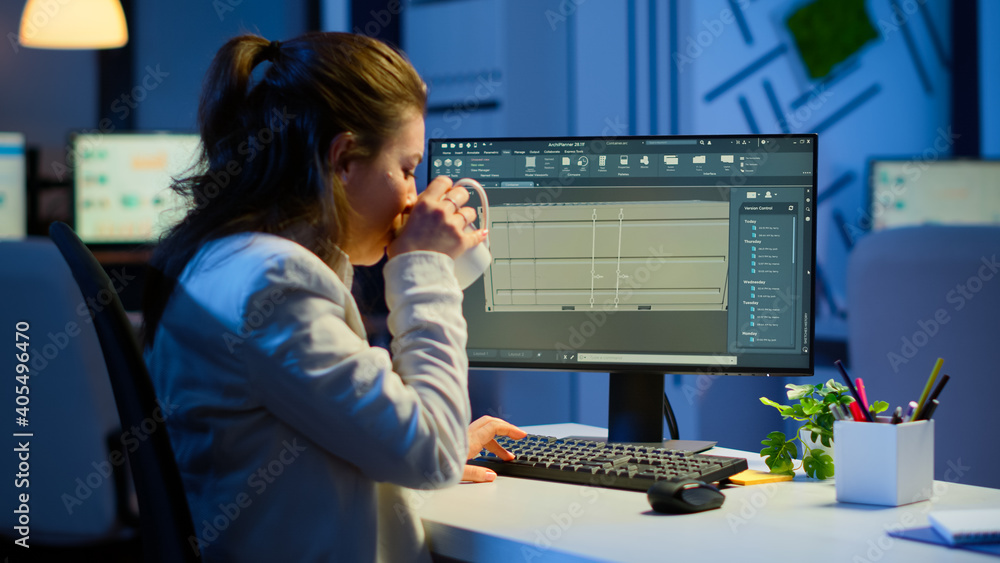 Poster freelancer architect working in 3d software to elaborate container design sitting at desk in busines