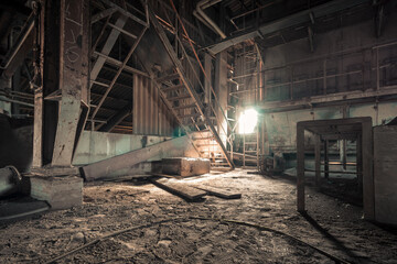 Fototapeta na wymiar Creepy abandoned industry area with natural decay a lost place a decayed factory hall