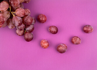 Bunch of grapes Red Globe on pink background