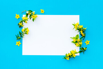 Spring card mockup with yellow flowers with leaves, top view