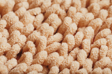 The structure of beige wool fibers in full screen as a background.