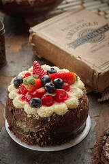 Black forest cake, Schwarzwald pie, dark chocolate and cherry dessert on a white wooden background.