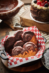 Palmier biscuits covered of chocolate on a plate. Heart-shaped puff pastry, pig's ear, palm leaves cookies, elephant ears, french hearts, shoe-soles.