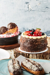 Black forest cake, Schwarzwald pie, dark chocolate and cherry dessert on a white wooden background.
